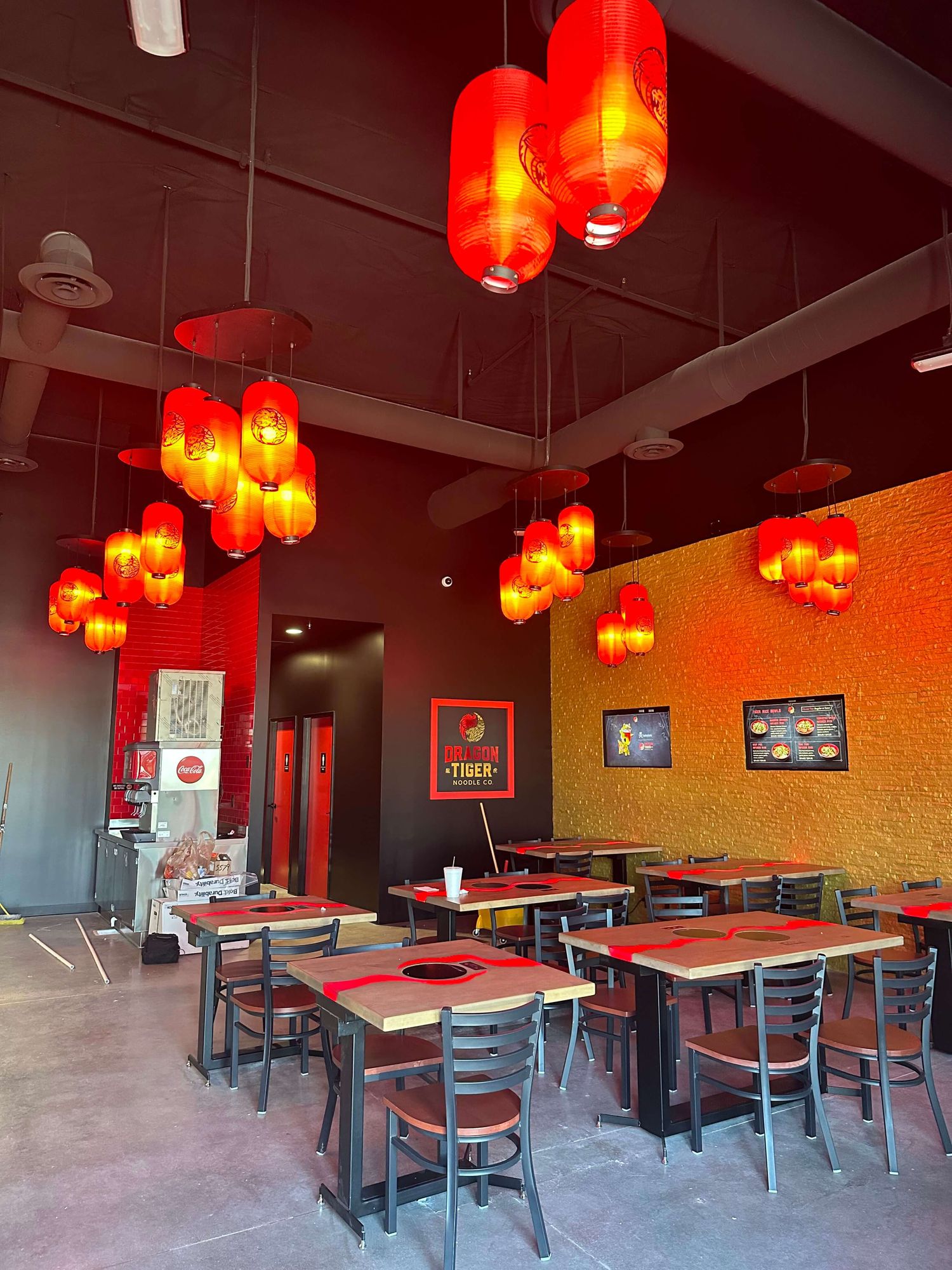 Dragon Tiger Noodle Co. dining room with red lanterns